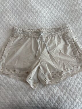 Athleta Cream Laser-Cut Athletic Shorts